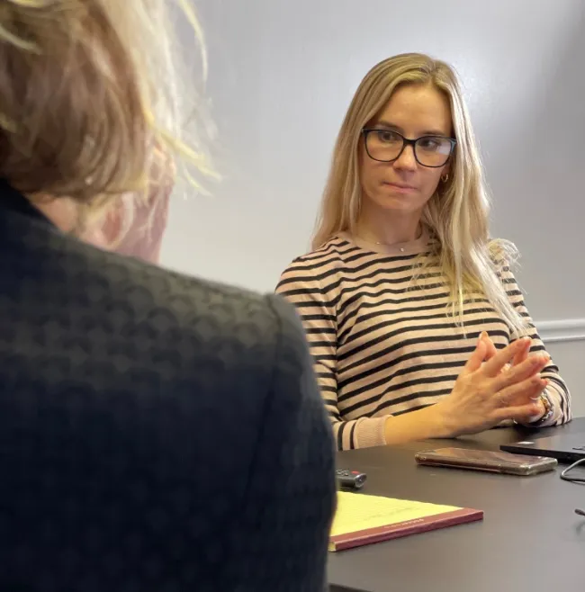 WSM team discussing a client.