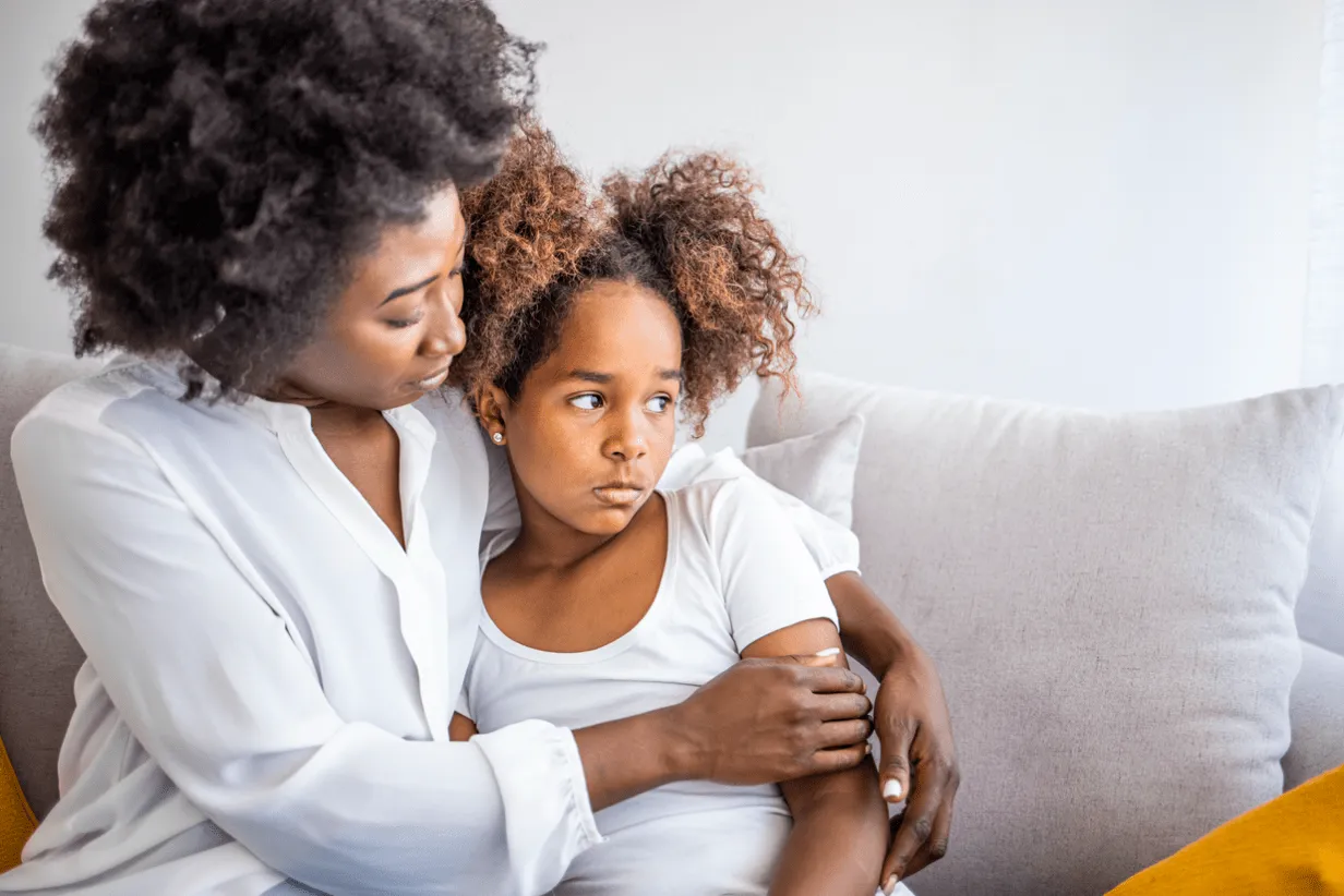 A woman sitting on her couch hugging her daughter with a concerned look on her face. Our divorce attorney for women’s rights knows it can be an uphill battle fighting for custody over a child and putting their needs first. Our women divorce attorneys can help you approach the legal proceedings with clarity and confidence.