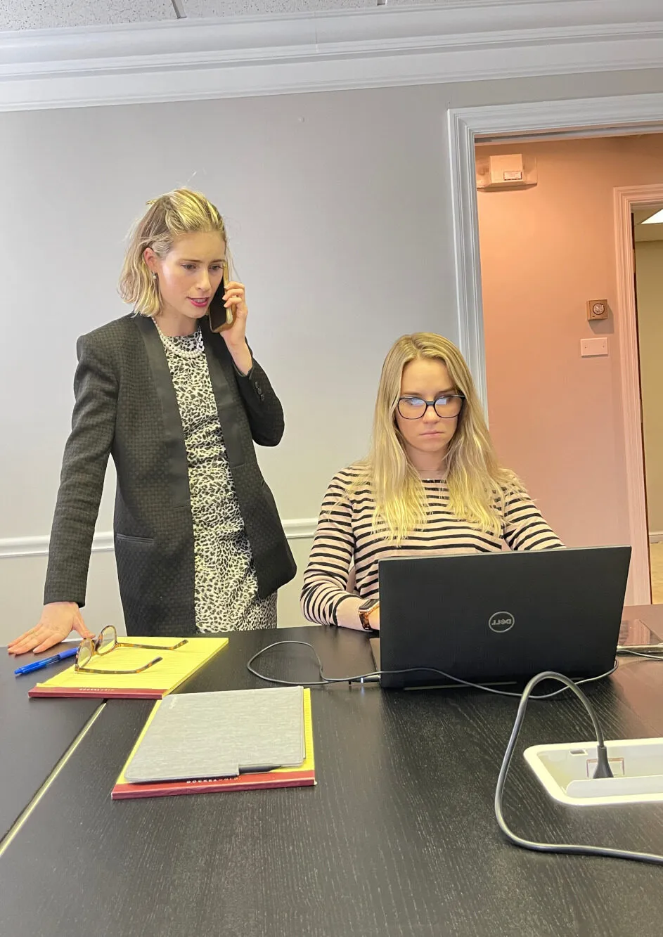 WSM's team of female divorce attorneys working in a conference room