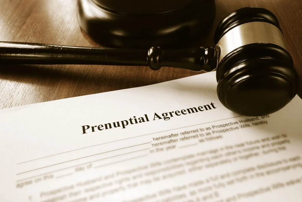 A contract with a gavel that reads prenup agreement.