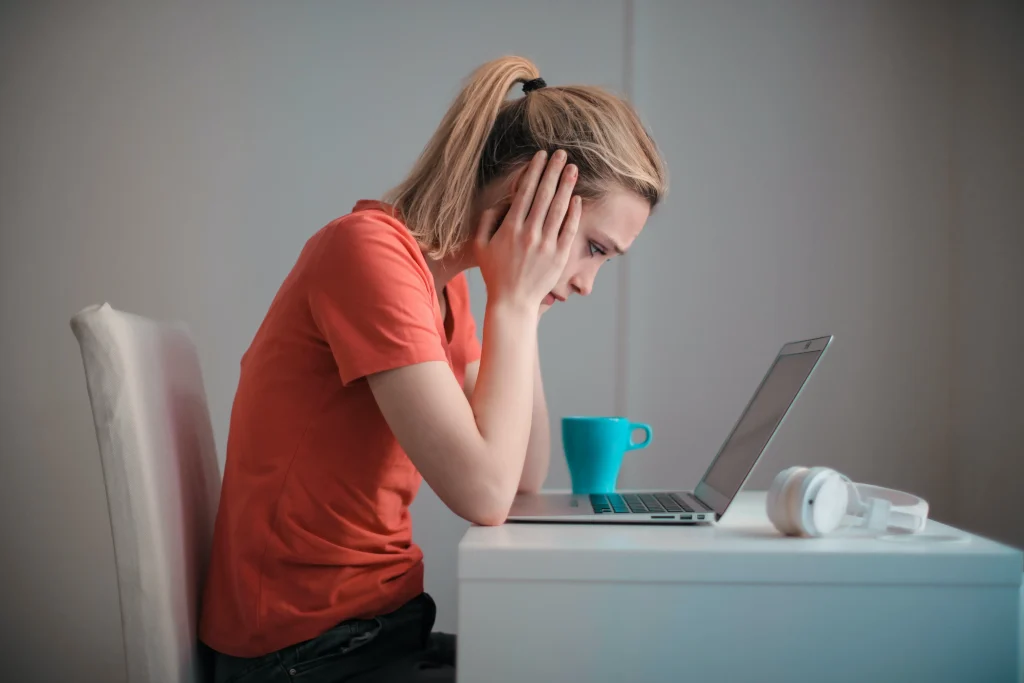 A woman looking at her computer.