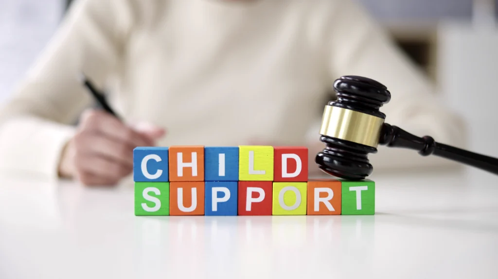 Concerned couple at child support meeting.